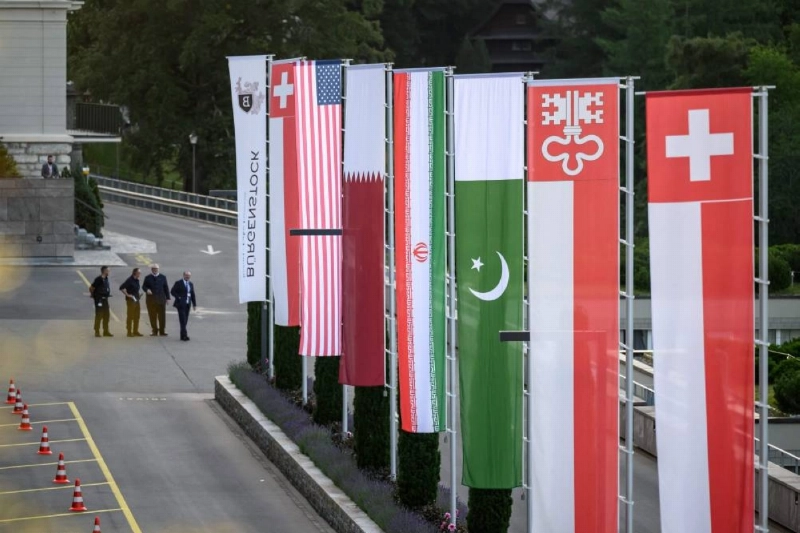 Flags of Switzerland, United States, Qatar, Pakistan and local Swiss canton of Nidwalden are photographed at the Burgenstock luxury hotel complex overlooking Lake Lucerne, Switzerland, on June 21, 2026, ahead of high-level talks aimed at advancing a deal to end the Middle East conflict. A new round of negotiations over the Middle East war was set to kick off on June 21, 2026 with Iranian negotiators arriving in the Swiss host city hours ahead of US Vice President JD Vance, even as Tehran said it was closing the Strait of Hormuz again over Israeli attacks in Lebanon. (Photo by Fabrice COFFRINI / AFP) Flags of Switzerland, United States, Qatar, Pakistan and local Swiss canton of Nidwalden are photographed at the Burgenstock luxury hotel complex overlooking Lake Lucerne, Switzerland, on June 21, 2026, ahead of high-level talks aimed at advancing a deal to end the Middle East conflict. A new round of negotiations over the Middle East war was set to kick off on June 21, 2026 with Iranian negotiators arriving in the Swiss host city hours ahead of US Vice President JD Vance, even as Tehran said it was closing the Strait of Hormuz again over Israeli attacks in Lebanon. (Photo by Fabrice COFFRINI / AFP)