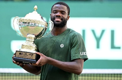 Frances Tiafoe of the US poses with the trophy after defeating his compatriot Taylor Fritz in the Halle Open final in Halle, western Germany, on June 21, 2026. (AFP) Frances Tiafoe of the US poses with the trophy after defeating his compatriot Taylor Fritz in the Halle Open final in Halle, western Germany, on June 21, 2026. (AFP)