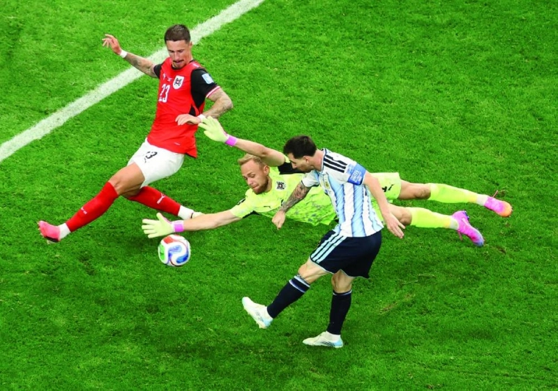 Lionel Messi scores past Marco Friedl of Austria at Dallas Stadium. (AFP) Lionel Messi scores past Marco Friedl of Austria at Dallas Stadium. (AFP)