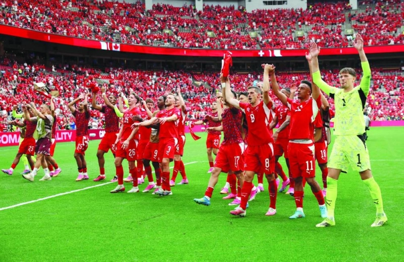 Players of Switzerland applaud fans after their 2-1 victory in the FIFA World Cup Group B match against Canada at BC Place Vancouver Stadium in Vancouver. (AFP) Players of Switzerland applaud fans after their 2-1 victory in the FIFA World Cup Group B match against Canada at BC Place Vancouver Stadium in Vancouver. (AFP)