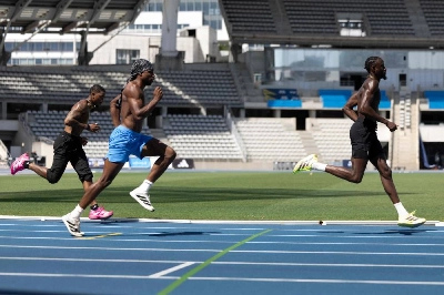 US sprinters Jordan Anthony (right) and Noah Lyles (centre) with Trinidad and Tobago's sprinter Jereem Richards (left) train on the tracks at Charlety Stadium in Paris on June 25, 2026. (AFP) US sprinters Jordan Anthony (right) and Noah Lyles (centre) with Trinidad and Tobago's sprinter Jereem Richards (left) train on the tracks at Charlety Stadium in Paris on June 25, 2026. (AFP)