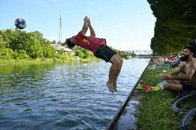 A boy jumps into the Dortmund-Ems Canal in Dortmund, western Germany on June 26, 2026 during a heatwave in Europe. (AFP) A boy jumps into the Dortmund-Ems Canal in Dortmund, western Germany on June 26, 2026 during a heatwave in Europe. (AFP)