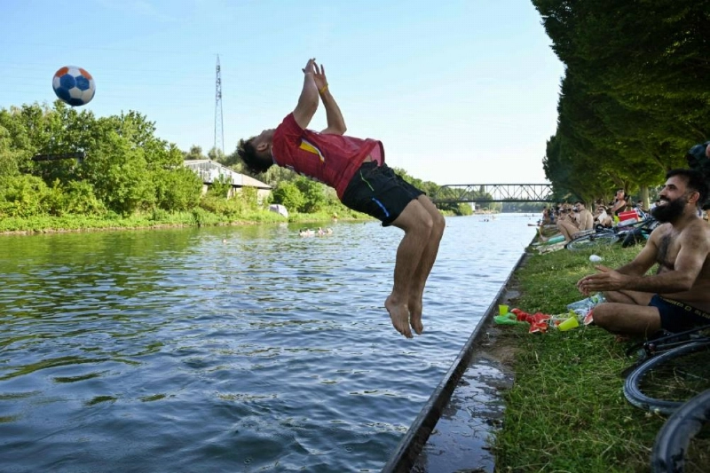 A boy jumps into the Dortmund-Ems Canal in Dortmund, western Germany on June 26, 2026 during a heatwave in Europe. (AFP) A boy jumps into the Dortmund-Ems Canal in Dortmund, western Germany on June 26, 2026 during a heatwave in Europe. (AFP)