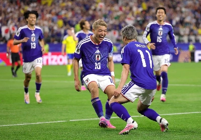 Japan’s Daizen Maeda celebrates with team-mate Ritsu Doan after scoring against Sweden at Dallas Stadium in Arlington, Texas. (AFP) Japan’s Daizen Maeda celebrates with team-mate Ritsu Doan after scoring against Sweden at Dallas Stadium in Arlington, Texas. (AFP)