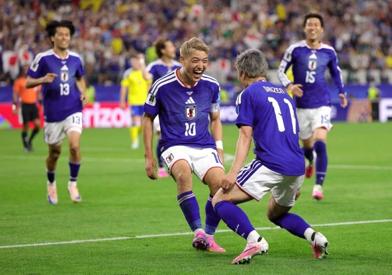 Japan’s Daizen Maeda celebrates with team-mate Ritsu Doan after scoring against Sweden at Dallas Stadium in Arlington, Texas. (AFP) Japan’s Daizen Maeda celebrates with team-mate Ritsu Doan after scoring against Sweden at Dallas Stadium in Arlington, Texas. (AFP)