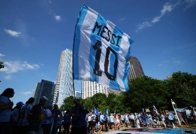 Argentina fans wave a flag depicting Lionel Messi's Argentina shirt during a traditional banderazo rally in Klyde Warren Park, Dallas, Texas, US, on June 26, 2026. (Reuters) Argentina fans wave a flag depicting Lionel Messi's Argentina shirt during a traditional banderazo rally in Klyde Warren Park, Dallas, Texas, US, on June 26, 2026. (Reuters)