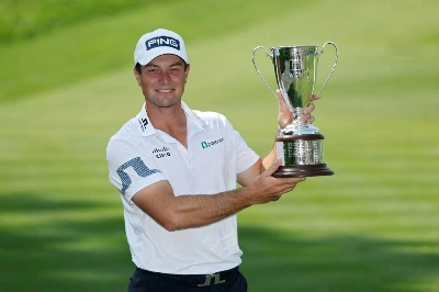 Viktor Hovland of Norway poses with the trophy after winning the Travelers Championship 2026 in a playoff at TPC River Highlands on June 29, 2026 in Cromwell, Connecticut. (AFP) Viktor Hovland of Norway poses with the trophy after winning the Travelers Championship 2026 in a playoff at TPC River Highlands on June 29, 2026 in Cromwell, Connecticut. (AFP)