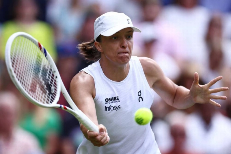 Poland’s Iga Swiatek returns the ball against US player Taylor Townsend during their first round tennis match on the second day of the 2026 Wimbledon Championships at The All England Lawn Tennis and Croquet Club in Wimbledon, southwest London, on June 30, 2026. (AFP) Poland’s Iga Swiatek returns the ball against US player Taylor Townsend during their first round tennis match on the second day of the 2026 Wimbledon Championships at The All England Lawn Tennis and Croquet Club in Wimbledon, southwest London, on June 30, 2026. (AFP)