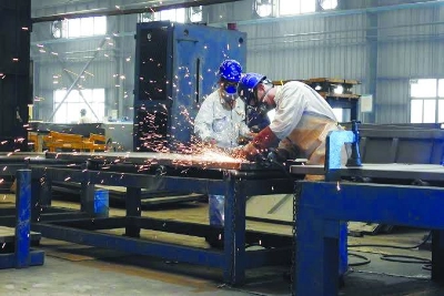 Workers weld shipping container components at a container manufacturing company in Lianyungang, China. Eurozone manufacturing output closed out its best quarter since early 2022 last month as US factory activity grew for a sixth straight month and an AI boom powered Asian producers, business surveys showed. Workers weld shipping container components at a container manufacturing company in Lianyungang, China. Eurozone manufacturing output closed out its best quarter since early 2022 last month as US factory activity grew for a sixth straight month and an AI boom powered Asian producers, business surveys showed.