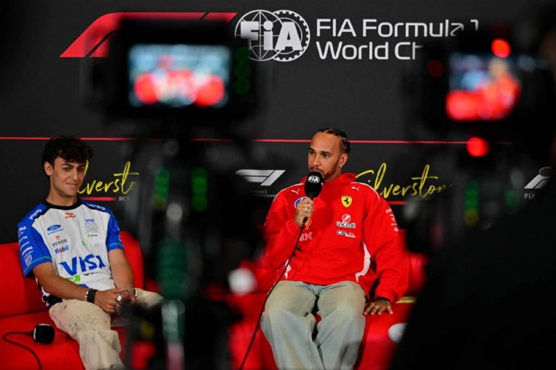 Racing Bulls' British driver Arvid Lindblad (left) and Ferrari's British driver Lewis Hamilton (centre) attend a press conference ahead of the British Grand Prix at the Silverstone motor racing circuit in Silverstone, central England, on July 2, 2026. (AFP) Racing Bulls' British driver Arvid Lindblad (left) and Ferrari's British driver Lewis Hamilton (centre) attend a press conference ahead of the British Grand Prix at the Silverstone motor racing circuit in Silverstone, central England, on July 2, 2026. (AFP)