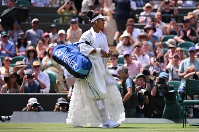 Japan's Naomi Osaka arrives at Court 1 ahead of her third-round match against Australia's Daria Kasatkina at Wimbledon in London. (Reuters) Japan's Naomi Osaka arrives at Court 1 ahead of her third-round match against Australia's Daria Kasatkina at Wimbledon in London. (Reuters)