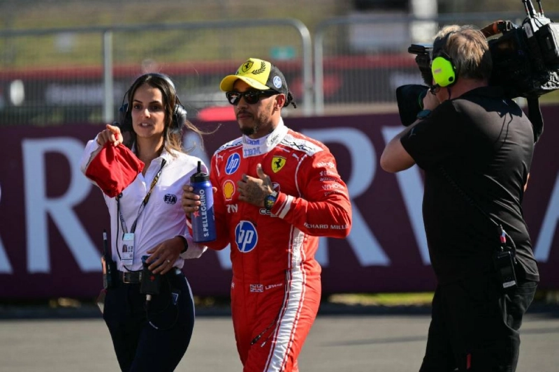Ferrari's British driver Lewis Hamilton (centre) reacts after taking pole position in the sprint qualifying session ahead of the British Grand Prix at the Silverstone motor racing circuit in Silverstone, central England, on July 3, 2026. (AFP) Ferrari's British driver Lewis Hamilton (centre) reacts after taking pole position in the sprint qualifying session ahead of the British Grand Prix at the Silverstone motor racing circuit in Silverstone, central England, on July 3, 2026. (AFP)