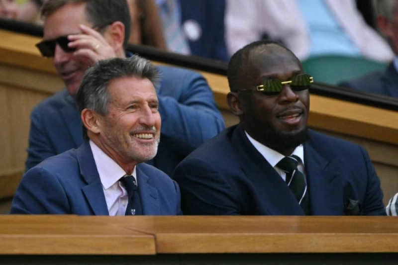 Retired track and field athlete Sebastian Coe (left) sits next to Jamaican retired sprinter Usain Bolt in the Centre Court's Royal Box to attend the match between France's Arthur Rinderknech and Serbia's Novak Djokovic. (AFP) Retired track and field athlete Sebastian Coe (left) sits next to Jamaican retired sprinter Usain Bolt in the Centre Court's Royal Box to attend the match between France's Arthur Rinderknech and Serbia's Novak Djokovic. (AFP)