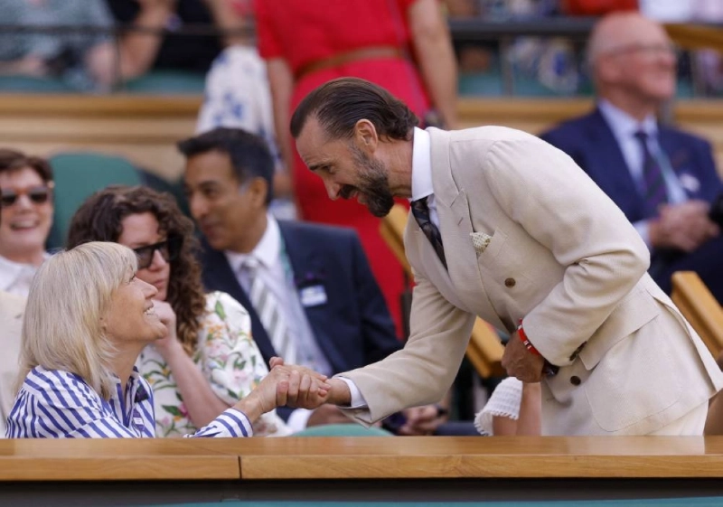 Actor Joseph Fiennes shakes hands with Deborah Jevans, Chair of the All England Lawn Tennis and Croquet Club in the Royal Box at Wimbledon on Friday. (Reuters) Actor Joseph Fiennes shakes hands with Deborah Jevans, Chair of the All England Lawn Tennis and Croquet Club in the Royal Box at Wimbledon on Friday. (Reuters)