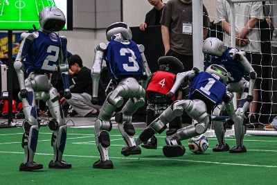 Robots take part in a football match at RoboCup 2026, a robotics and Artificial Intelligence (AI) competition in Incheon on July 3, 2026. (Photo by Jade GAO / AFP) Robots take part in a football match at RoboCup 2026, a robotics and Artificial Intelligence (AI) competition in Incheon on July 3, 2026. (Photo by Jade GAO / AFP)
