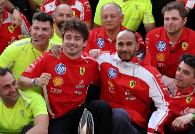 Charles Leclerc (left) and third-placed Lewis Hamilton celebrate with their Ferrari teammates after the British Grand Prix at the Silverstone Circuit in Britain on Sunday. (Reuters) Charles Leclerc (left) and third-placed Lewis Hamilton celebrate with their Ferrari teammates after the British Grand Prix at the Silverstone Circuit in Britain on Sunday. (Reuters)