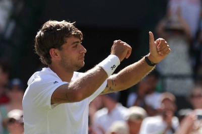 Italy's Flavio Cobolli celebrates after winning his fourth-round match against Australia's Alex de Minaur. (Reuters) Italy's Flavio Cobolli celebrates after winning his fourth-round match against Australia's Alex de Minaur. (Reuters)