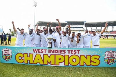 West Indies celebrate winning with the Sobers and Tissera trophy at the end of the fifth and final day of the second Test between Sri Lanka and West Indies at Vivian Richards Cricket Stadium in North Sound, Antigua and Barbuda, on July 7, 2026. (AFP) West Indies celebrate winning with the Sobers and Tissera trophy at the end of the fifth and final day of the second Test between Sri Lanka and West Indies at Vivian Richards Cricket Stadium in North Sound, Antigua and Barbuda, on July 7, 2026. (AFP)
