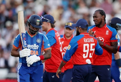 England's Jofra Archer celebrates with Sam Curran and Adil Rashid after taking the wicket of India's Shreyas Iyer caught out by Jacob Bethell during the third T20 International at Trent Bridge Cricket Ground, Nottingham, Britain, on July 7, 2026. (Reuters)
England's Jofra Archer celebrates with Sam Curran and Adil Rashid after taking the wicket of India's Shreyas Iyer caught out by Jacob Bethell during the third T20 International at Trent Bridge Cricket Ground, Nottingham, Britain, on July 7, 2026. (Reuters)
