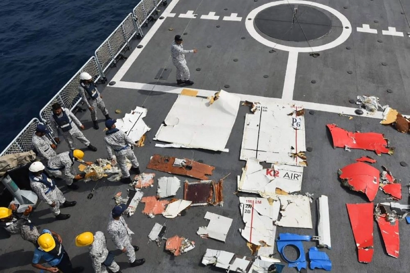 This handout photograph taken on July 8, 2026 and released by the Pakistan Airports Authority shows Pakistan Navy and Pakistan Maritime Security Agency personnel standing next to the wreckage of the K2 Airways Cargo Boeing 737, after it was recovered during a search and rescue operation in the Arabian Sea, off Ormara town. Pakistan located the wreckage of a Boeing cargo plane on July 8, the country's airports authority said, adding that rescuers were searching for five crew on board when the aircraft had gone missing. (Photo by Pakistan Airports Authority / AFP) / RESTRICTED TO EDITORIAL USE - MANDATORY CREDIT "AFP PHOTO / Pakistan Airports Authority / - " - HANDOUT - NO MARKETING NO ADVERTISING CAMPAIGNS - DISTRIBUTED AS A SERVICE TO CLIENTS This handout photograph taken on July 8, 2026 and released by the Pakistan Airports Authority shows Pakistan Navy and Pakistan Maritime Security Agency personnel standing next to the wreckage of the K2 Airways Cargo Boeing 737, after it was recovered during a search and rescue operation in the Arabian Sea, off Ormara town. Pakistan located the wreckage of a Boeing cargo plane on July 8, the country's airports authority said, adding that rescuers were searching for five crew on board when the aircraft had gone missing. (Photo by Pakistan Airports Authority / AFP) / RESTRICTED TO EDITORIAL USE - MANDATORY CREDIT "AFP PHOTO / Pakistan Airports Authority / - " - HANDOUT - NO MARKETING NO ADVERTISING CAMPAIGNS - DISTRIBUTED AS A SERVICE TO CLIENTS