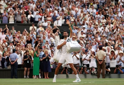 Serbia's Novak Djokovic waves to spectators as he leaves the court after losing his semi final match against Italy's Jannik Sinner at Wimbledon. (Reuters) Serbia's Novak Djokovic waves to spectators as he leaves the court after losing his semi final match against Italy's Jannik Sinner at Wimbledon. (Reuters)