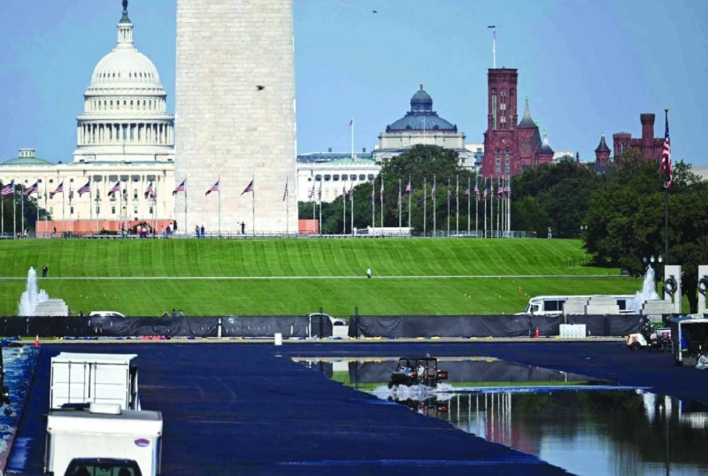 The US Capitol is seen in the distance as contractors drive a vehicle in the partially filled Lincoln Memorial Reflecting Pool during renovation work on the National Mall in Washington, DC, on June 4, 2026. (Photo by Kent NISHIMURA / AFP) The US Capitol is seen in the distance as contractors drive a vehicle in the partially filled Lincoln Memorial Reflecting Pool during renovation work on the National Mall in Washington, DC, on June 4, 2026. (Photo by Kent NISHIMURA / AFP)
