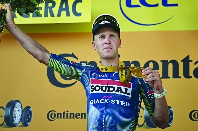 Soudal Quick-Step team's Belgian rider Tim Merlier celebrates on the podium after winning the 8th stage of the 113th edition of the Tour de France, 182 km between Périgueux and Bergerac in southwestern France, on July 11, 2026. (AFP) Soudal Quick-Step team's Belgian rider Tim Merlier celebrates on the podium after winning the 8th stage of the 113th edition of the Tour de France, 182 km between Périgueux and Bergerac in southwestern France, on July 11, 2026. (AFP)