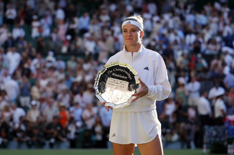 Czech Republic's Karolina Muchova poses with the runner-up trophy after losing her final match against Czech Republic's Linda Noskova at Wimbledon on Saturday. (Reuters) Czech Republic's Karolina Muchova poses with the runner-up trophy after losing her final match against Czech Republic's Linda Noskova at Wimbledon on Saturday. (Reuters)