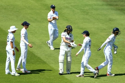 England players congratulate India's Yastika Bhatia as she walks after losing her wicket, dismissed by England's Mady Villiers off the bowling of Sophie Ecclestone during day three of the Women's Test at Lord's Cricket Ground, London, Britain on Sunday. (Reuters) England players congratulate India's Yastika Bhatia as she walks after losing her wicket, dismissed by England's Mady Villiers off the bowling of Sophie Ecclestone during day three of the Women's Test at Lord's Cricket Ground, London, Britain on Sunday. (Reuters)