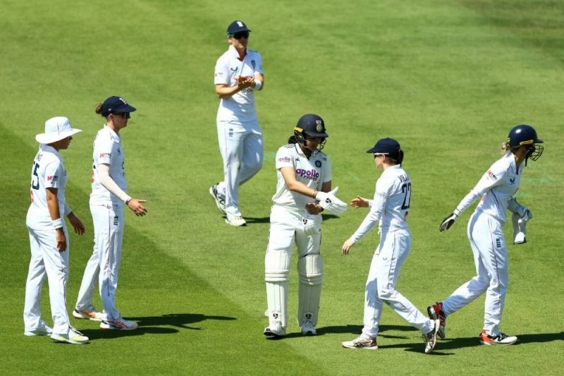 England players congratulate India's Yastika Bhatia as she walks after losing her wicket, dismissed by England's Mady Villiers off the bowling of Sophie Ecclestone during day three of the Women's Test at Lord's Cricket Ground, London, Britain on Sunday. (Reuters) England players congratulate India's Yastika Bhatia as she walks after losing her wicket, dismissed by England's Mady Villiers off the bowling of Sophie Ecclestone during day three of the Women's Test at Lord's Cricket Ground, London, Britain on Sunday. (Reuters)