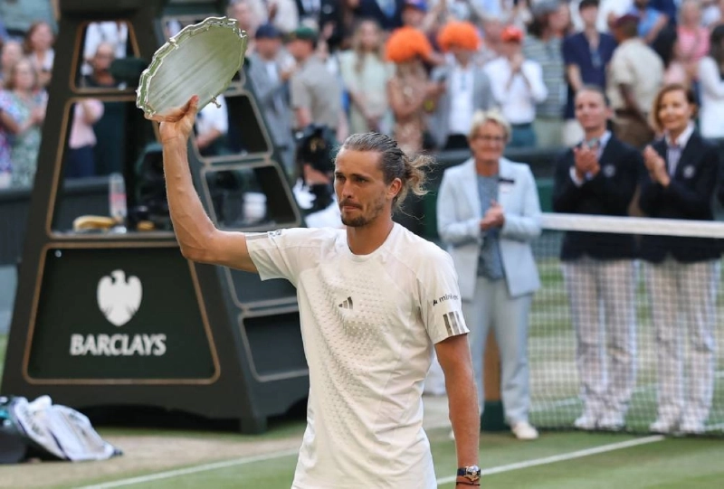 Germany's Alexander Zverev celebrates with the runner-up trophy after his final match against Italy's Jannik Sinner at Wimbledon on Sunday. (Reuters) Germany's Alexander Zverev celebrates with the runner-up trophy after his final match against Italy's Jannik Sinner at Wimbledon on Sunday. (Reuters)