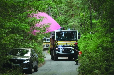 A fire truck sprays fire retardant into the Fontainebleau Forest on the outskirts of a wildfire near Noisy-sur-Ecole in France’s Ile-de-France region, Monday. (AFP) A fire truck sprays fire retardant into the Fontainebleau Forest on the outskirts of a wildfire near Noisy-sur-Ecole in France’s Ile-de-France region, Monday. (AFP)