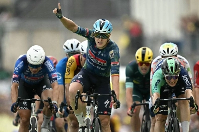 Soudal Quick-Step team's Belgian rider Tim Merlier cycles to the finish line to win the 12th stage of the 113th edition of the Tour de France, 181 km between Circuit de Nevers Magny-Cours and Chalon-sur-Saône in central France, on July 16, 2026. (AFP) Soudal Quick-Step team's Belgian rider Tim Merlier cycles to the finish line to win the 12th stage of the 113th edition of the Tour de France, 181 km between Circuit de Nevers Magny-Cours and Chalon-sur-Saône in central France, on July 16, 2026. (AFP)