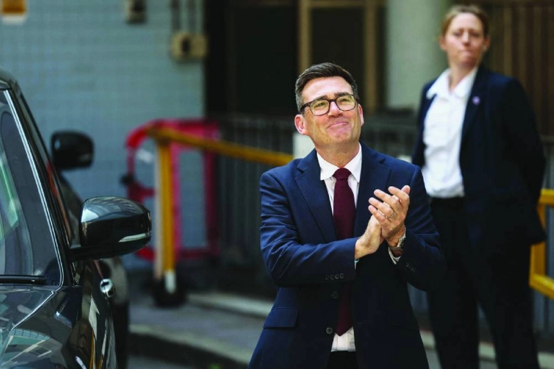 Andy Burnham smiles as he leaves Labour’s 'Special Conference' where he was confirmed as the Labour Party's new leader and the country's next prime minister, in central London yesterday. (AFP) Andy Burnham smiles as he leaves Labour’s 'Special Conference' where he was confirmed as the Labour Party's new leader and the country's next prime minister, in central London yesterday. (AFP)