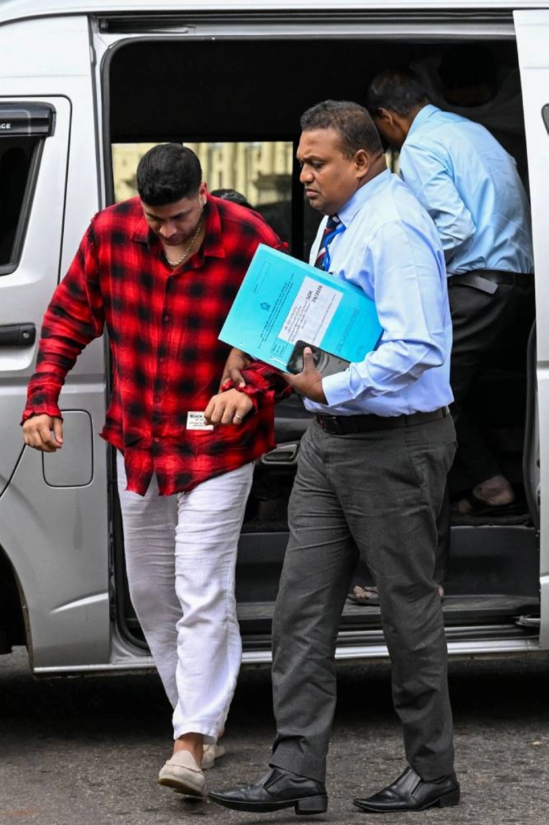 Lanka Premier League (LPL) franchise Jaffna Kings team co-owner Manjot Kalra (left) is taken to court after being arrested by the Sri Lanka Sports Investigation Unit for alleged match-fixing in Colombo on July 17, 2026. (AFP) Lanka Premier League (LPL) franchise Jaffna Kings team co-owner Manjot Kalra (left) is taken to court after being arrested by the Sri Lanka Sports Investigation Unit for alleged match-fixing in Colombo on July 17, 2026. (AFP)
