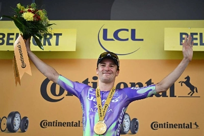 Team Jayco AlUla's Swiss rider Mauro Schmid celebrates on the podium after winning the 13th stage of the 113th edition of the Tour de France cycling race, 205,8 km between Dole and Belfort in eastern France, on July 17, 2026. (AFP) Team Jayco AlUla's Swiss rider Mauro Schmid celebrates on the podium after winning the 13th stage of the 113th edition of the Tour de France cycling race, 205,8 km between Dole and Belfort in eastern France, on July 17, 2026. (AFP)