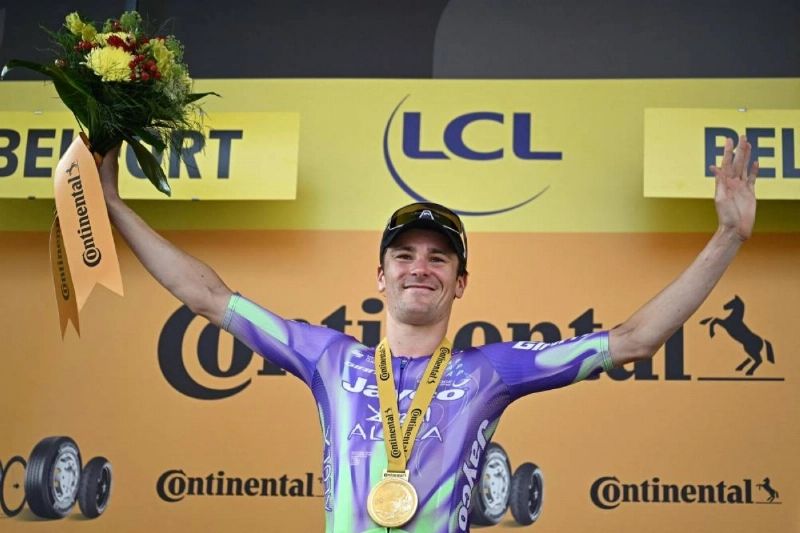 Team Jayco AlUla's Swiss rider Mauro Schmid celebrates on the podium after winning the 13th stage of the 113th edition of the Tour de France cycling race, 205,8 km between Dole and Belfort in eastern France, on July 17, 2026. (AFP) Team Jayco AlUla's Swiss rider Mauro Schmid celebrates on the podium after winning the 13th stage of the 113th edition of the Tour de France cycling race, 205,8 km between Dole and Belfort in eastern France, on July 17, 2026. (AFP)