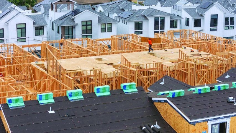 A drone view shows construction personnel working on a multi-home residential project in California. US single-family home-building fell for a third straight month in June while permits for future construction dropped to the lowest level in 10 months. A drone view shows construction personnel working on a multi-home residential project in California. US single-family home-building fell for a third straight month in June while permits for future construction dropped to the lowest level in 10 months.