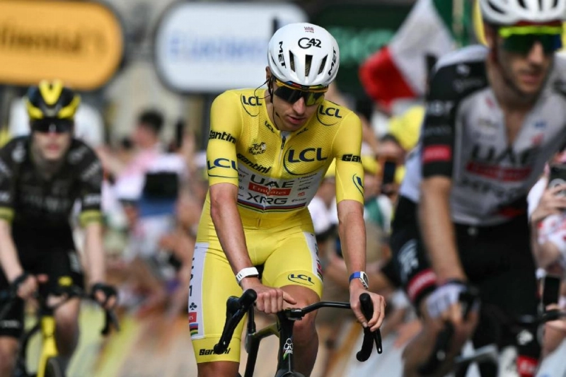 UAE Team Emirates - XRG's Slovenian rider Tadej Pogacar wearing the overall leader's yellow jersey cycles to the finish line of the 13th stage of the 113th edition of the Tour de France cycling race, 205,8 km between Dole and Belfort in eastern France, on July 17, 2026. (AFP) UAE Team Emirates - XRG's Slovenian rider Tadej Pogacar wearing the overall leader's yellow jersey cycles to the finish line of the 13th stage of the 113th edition of the Tour de France cycling race, 205,8 km between Dole and Belfort in eastern France, on July 17, 2026. (AFP)