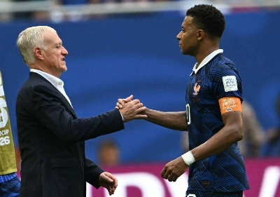 France's head coach Didier Deschamps and France's forward Kylian Mbappe shake hands after losing the World Cup third-place match against England at the Miami Stadium in Miami on July 18, 2026. (AFP) France's head coach Didier Deschamps and France's forward Kylian Mbappe shake hands after losing the World Cup third-place match against England at the Miami Stadium in Miami on July 18, 2026. (AFP)