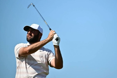 American golfer Scottie Scheffler watches his iron shot from the 12th tee on day four of the 154th Open at Royal Birkdale Golf Club near Southport in north-west England on July 19, 2026. (AFP) American golfer Scottie Scheffler watches his iron shot from the 12th tee on day four of the 154th Open at Royal Birkdale Golf Club near Southport in north-west England on July 19, 2026. (AFP)