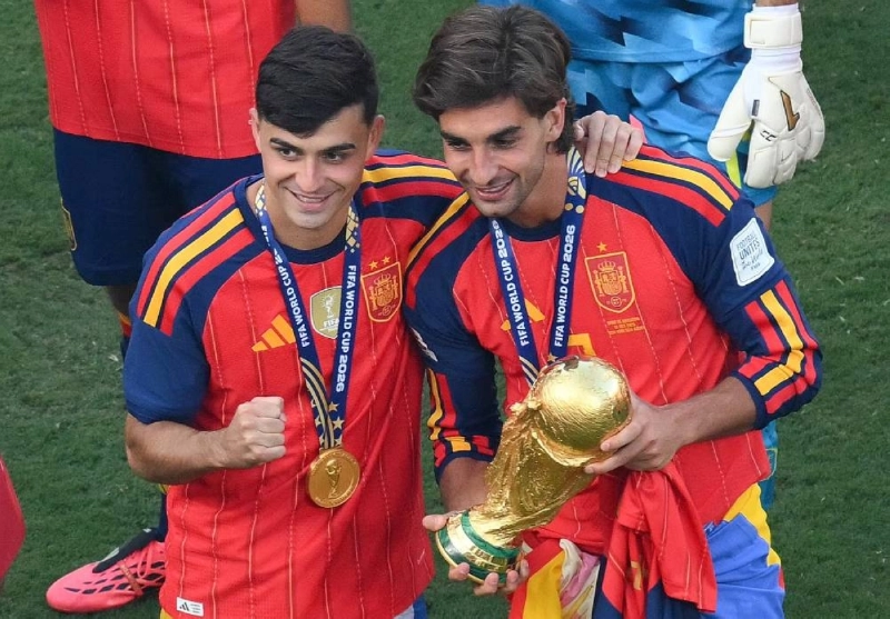 Spain's midfielder Pedri (left) and forward Ferran Torres pose with the FIFA World Cup trophy after the tournament final against Argentina at the New York/New Jersey Stadium in East Rutherford on July 19, 2026. (AFP) Spain's midfielder Pedri (left) and forward Ferran Torres pose with the FIFA World Cup trophy after the tournament final against Argentina at the New York/New Jersey Stadium in East Rutherford on July 19, 2026. (AFP)