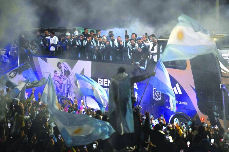 Argentina players ride aboard an open-top bus towards the Argentine Football Association training camp in Ezeiza, Buenos Aires, on July 20, 2026, after returning from the United States following its defeat in the FIFA World Cup final. (AFP) Argentina players ride aboard an open-top bus towards the Argentine Football Association training camp in Ezeiza, Buenos Aires, on July 20, 2026, after returning from the United States following its defeat in the FIFA World Cup final. (AFP)