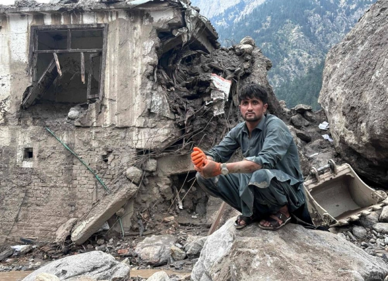 An Afghan man sits near the rubble of a damaged house following flash floods at Parun town in Afghanistan's Nuristan province on July 21, 2026. Heavy rain and warnings of further flooding dampened the search on July 21, for dozens of residents missing in eastern Afghanistan, after a major deluge smashed through one province killing at least 23 people. (Photo by AFP) An Afghan man sits near the rubble of a damaged house following flash floods at Parun town in Afghanistan's Nuristan province on July 21, 2026. Heavy rain and warnings of further flooding dampened the search on July 21, for dozens of residents missing in eastern Afghanistan, after a major deluge smashed through one province killing at least 23 people. (Photo by AFP)