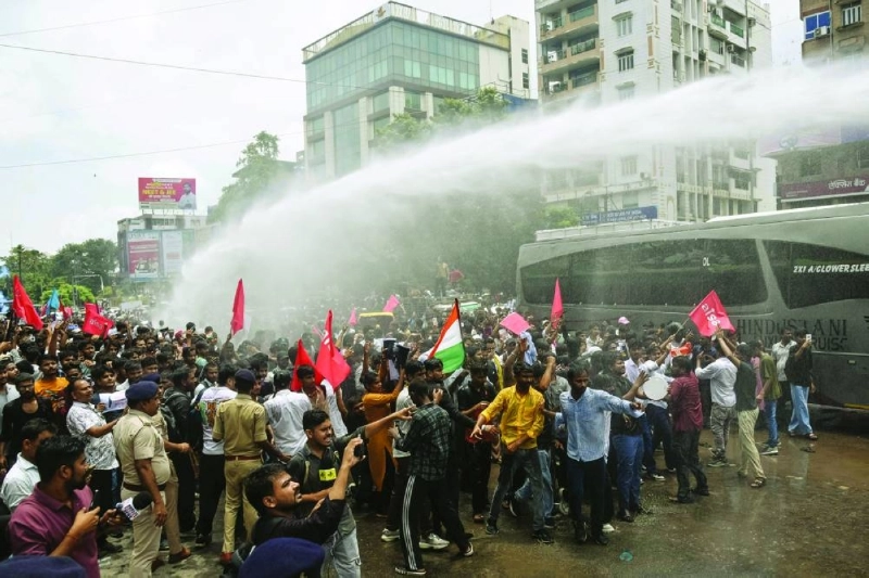 Police personnel use water cannons to disperse demonstrators during a protest march in Patna Wednesday demanding the resignation of India’s Education Minister Dharmendra Pradhan over alleged NEET exam irregularities. (AFP) Police personnel use water cannons to disperse demonstrators during a protest march in Patna Wednesday demanding the resignation of India’s Education Minister Dharmendra Pradhan over alleged NEET exam irregularities. (AFP)