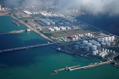 Oil and gas tanks are seen at an oil warehouse at a port in Zhuhai, China. Some Chinese refiners have ramped up purchases of sanctioned Russian crude despite shrinking discounts, as an escalation in the Iran war disrupts exports from the Middle East, sources familiar with the situation said. Oil and gas tanks are seen at an oil warehouse at a port in Zhuhai, China. Some Chinese refiners have ramped up purchases of sanctioned Russian crude despite shrinking discounts, as an escalation in the Iran war disrupts exports from the Middle East, sources familiar with the situation said.