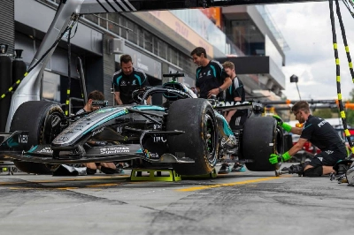 Mechanics and engineers work on the car of Mercedes' British driver George Russell ahead of the Formula One Hungarian Grand Prix at the Hungaroring circuit in Mogyorod near Budapest, Hungary, on July 23, 2026. (AFP) Mechanics and engineers work on the car of Mercedes' British driver George Russell ahead of the Formula One Hungarian Grand Prix at the Hungaroring circuit in Mogyorod near Budapest, Hungary, on July 23, 2026. (AFP)