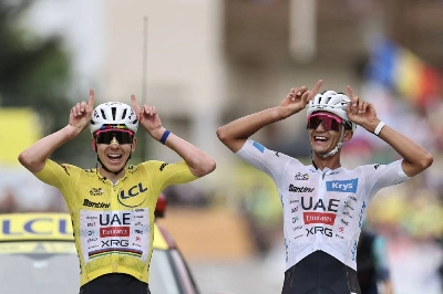 Slovenian rider Tadej Pogacar wearing the overall leader's yellow jersey and Mexican rider Isaac Del Toro wearing the best young rider's white jersey celebrate as they cross the finish line of the 20th stage of the 113th edition of the Tour de France, 170,9 km between Le Bourg-d'Oisans and Alpe d'Huez in the French Alps, on July 25, 2026. (AFP) Slovenian rider Tadej Pogacar wearing the overall leader's yellow jersey and Mexican rider Isaac Del Toro wearing the best young rider's white jersey celebrate as they cross the finish line of the 20th stage of the 113th edition of the Tour de France, 170,9 km between Le Bourg-d'Oisans and Alpe d'Huez in the French Alps, on July 25, 2026. (AFP)