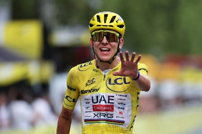 Slovenian rider Tadej Pogacar celebrates his overall victory as he crosses the finish line of the 21st stage of the 113th edition of the Tour de France, 88,7 km starting and finishing in Paris, on July 26, 2026. (AFP) Slovenian rider Tadej Pogacar celebrates his overall victory as he crosses the finish line of the 21st stage of the 113th edition of the Tour de France, 88,7 km starting and finishing in Paris, on July 26, 2026. (AFP)