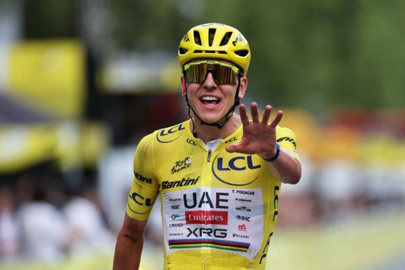 Slovenian rider Tadej Pogacar celebrates his overall victory as he crosses the finish line of the 21st stage of the 113th edition of the Tour de France, 88,7 km starting and finishing in Paris, on July 26, 2026. (AFP) Slovenian rider Tadej Pogacar celebrates his overall victory as he crosses the finish line of the 21st stage of the 113th edition of the Tour de France, 88,7 km starting and finishing in Paris, on July 26, 2026. (AFP)